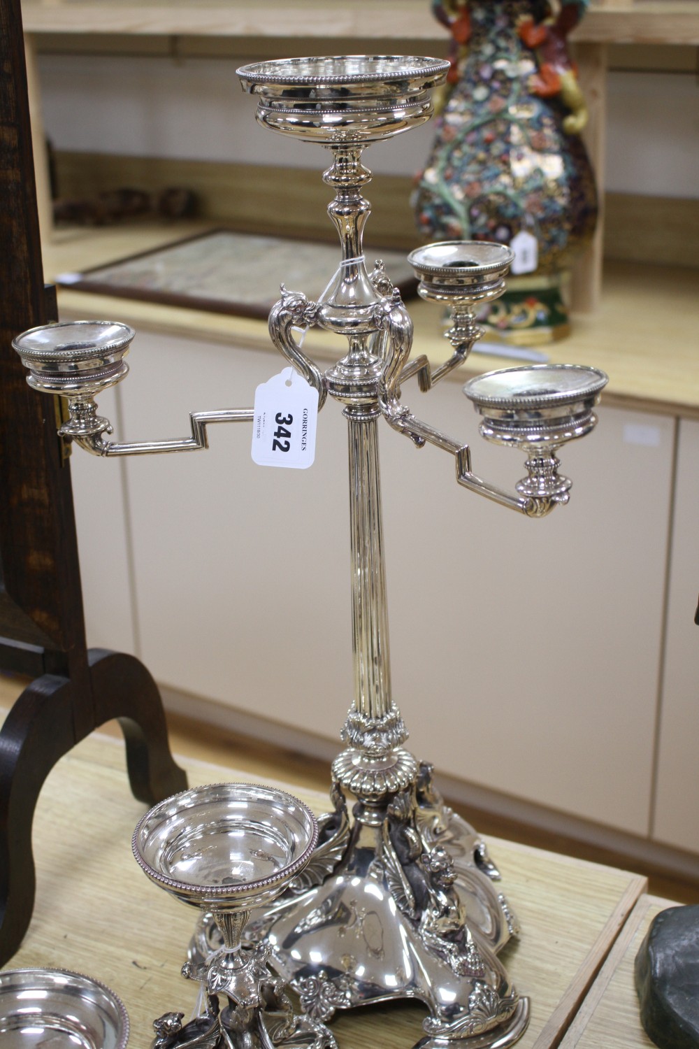 A Victorian electroplated three-piece table garniture by Elkington & Co. (lacking glass bowls), tallest 22.25in.